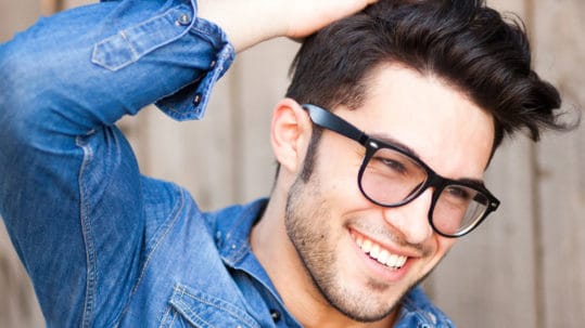 Young man with glasses and great smile.